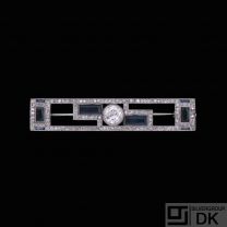 Art deco Platinum Brooch with 1.0 Ct. Diamond and Sapphires.