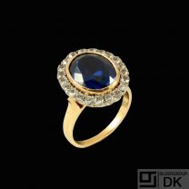 18k Gold Cocktail Ring with Synthetic Sapphire and 21 Diamonds.