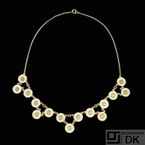 A. Michelsen. Gilded Silver Daisy Necklace with white enamel.