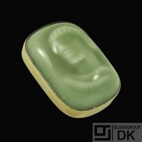 Jais Nielsen 1885-1961. Ceramic Brooch with Celadon glace and gilded silver mounting.