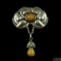 Evald Nielsen 1879 - 1958. Art Nouveau Silver Brooch with Amber