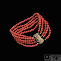 Five-Strand Coral Bead Bracelet with gilded silver lock.