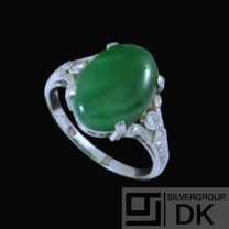 Platinum Cocktail Ring with Oval Jade and Diamonds.
