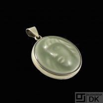 Jais Nielsen. Ceramic Pendant with Celadon Glace and gilded silver mounting.