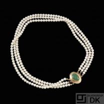 Knud V. Andersen. Three-Strand Pearl Necklace with 14k Gold Lock with Jade.