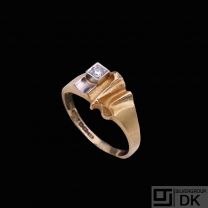 Lapponia. 18k Gold Ring with Platinum and Diamond 0.03	ct.- Björn Weckström 1995.