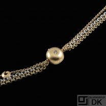 Ole Lynggaard. Three-strand 14k White & Yellow Gold Necklace with Diamond Pendant.