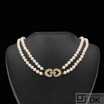 Two-Strand Pearl Necklace with 18k Gold Diamond lock.