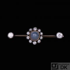 14k Gold Brooch with Diamonds and Star-Sapphire.