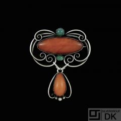 Otto Strange Friis. Silver Brooch with Amber and green Agates.